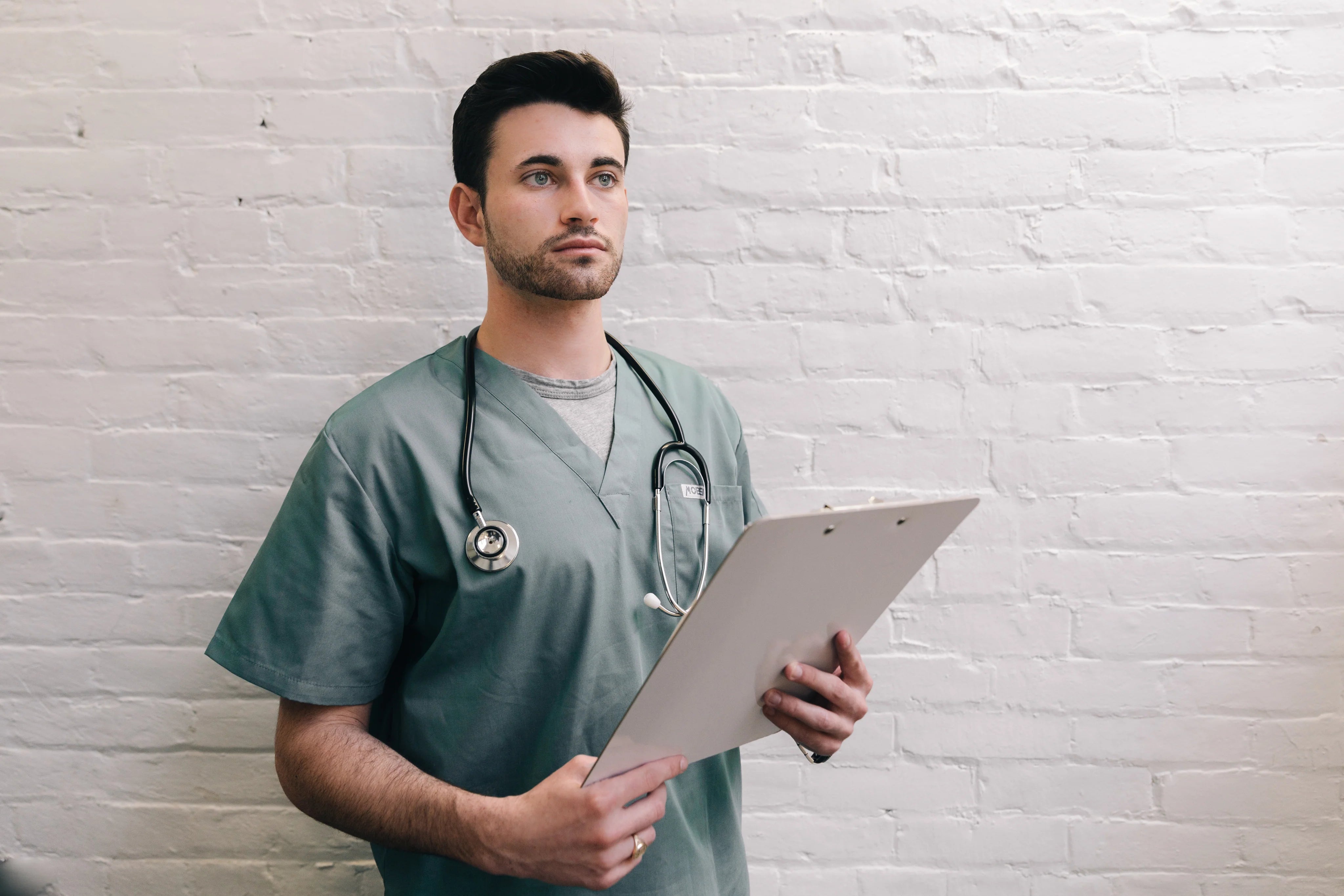 files/male-doctor-holding-clipboard.webp